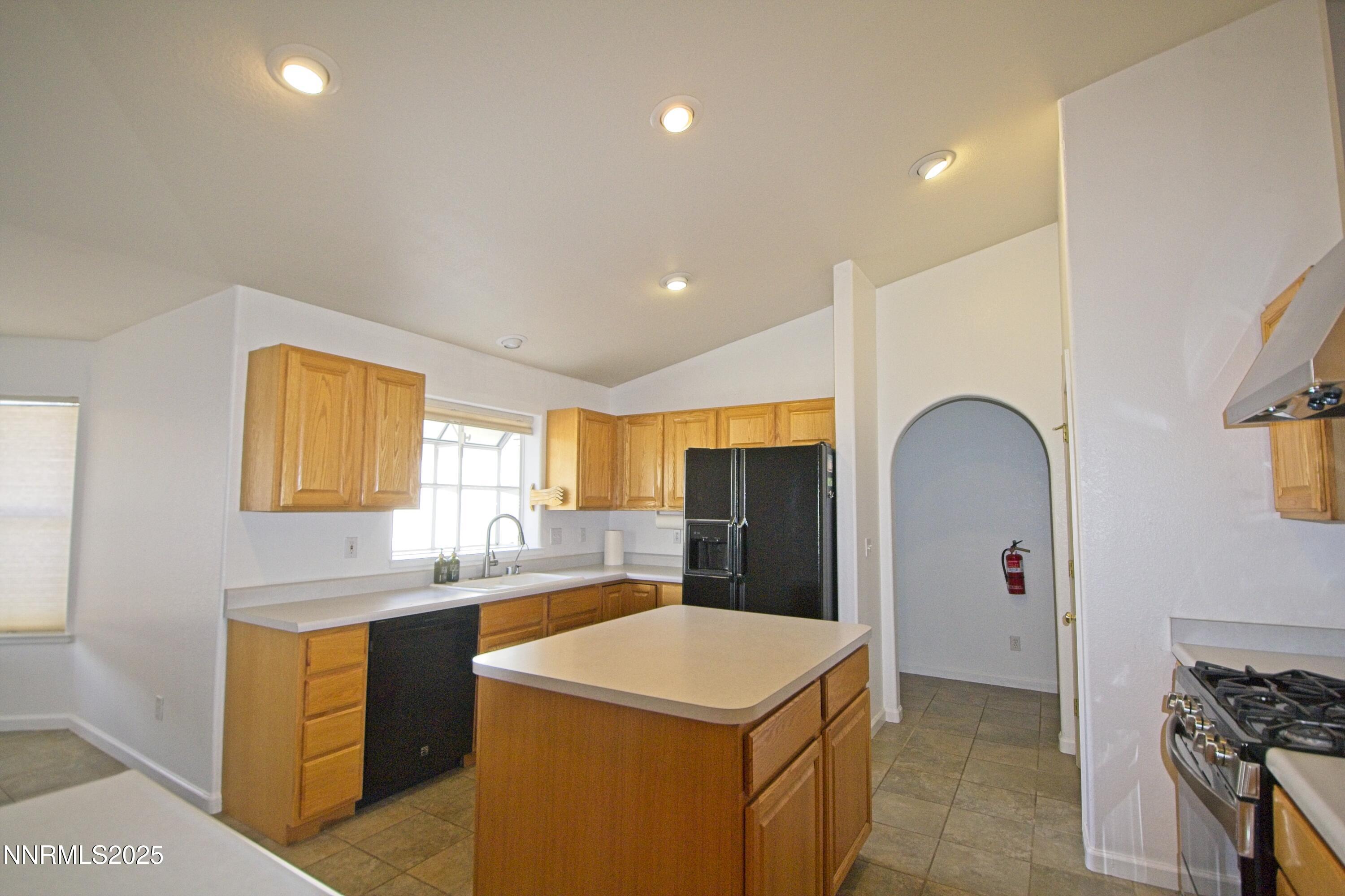 1905 Lakeshore Drive Washoe Valley, NV 89704 - Photo 6 of 31 a kitchen with stainless steel appliances a sink stove and refrigerator