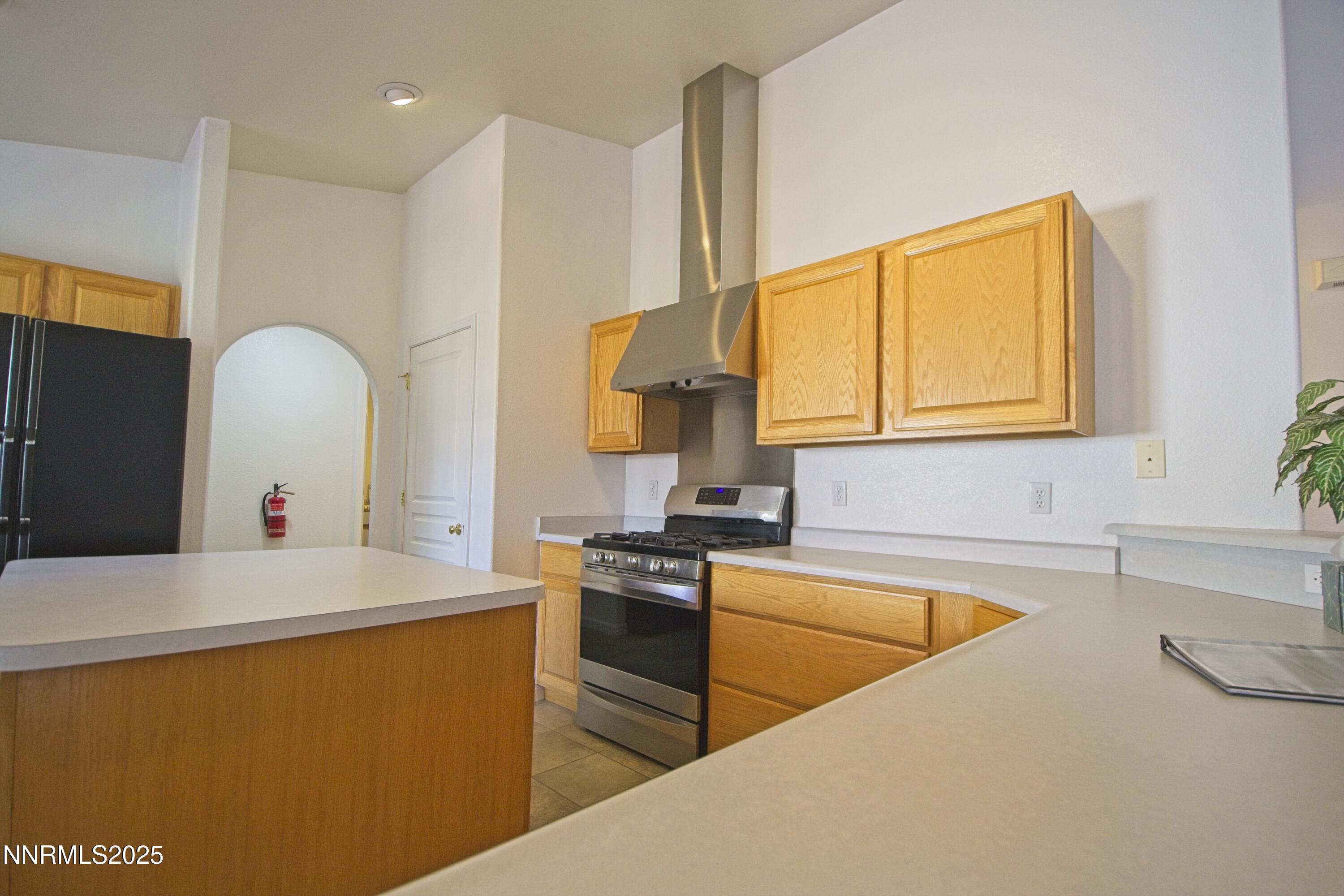 1905 Lakeshore Drive Washoe Valley, NV 89704 - Photo 7 of 31 a kitchen that has a sink and a stove