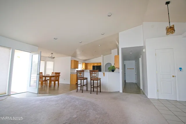 a view of kitchen with furniture and refrigerator