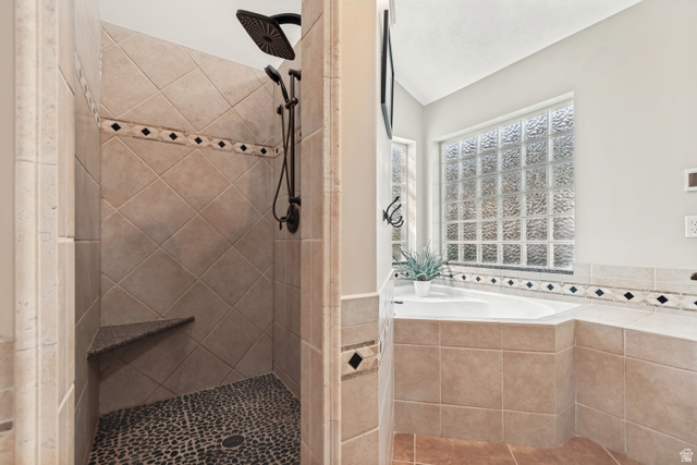 1567 Ridgeview Circle Farmington, UT 84025 - Photo 26 of 55 Spa-inspired primary bathroom featuring a custom walk-in shower with diagonal tile layout, rainfall showerhead, and pebble stone flooring