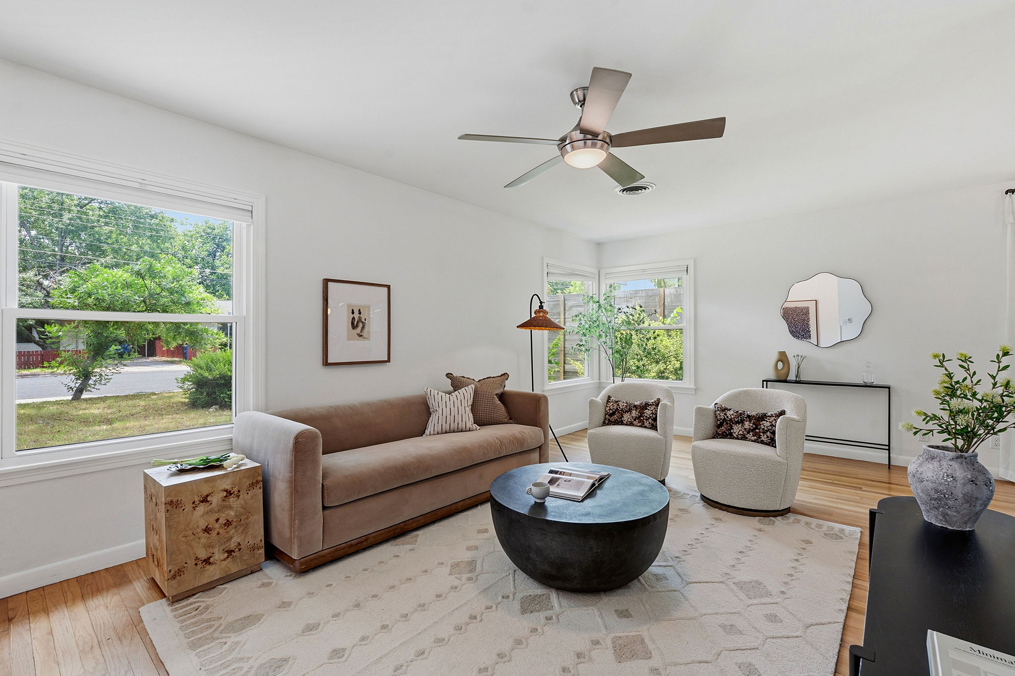 900 Stark Street Austin, TX 78756 - Photo 4 of 25 Hardwood floors and a soothing color palette create an inviting living room for all.