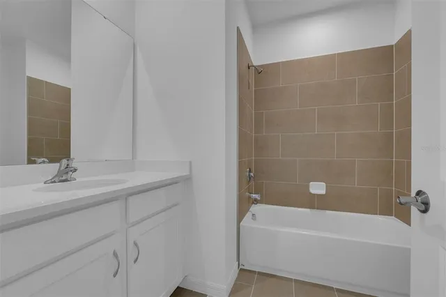 a bathroom with a bathtub and a toilet