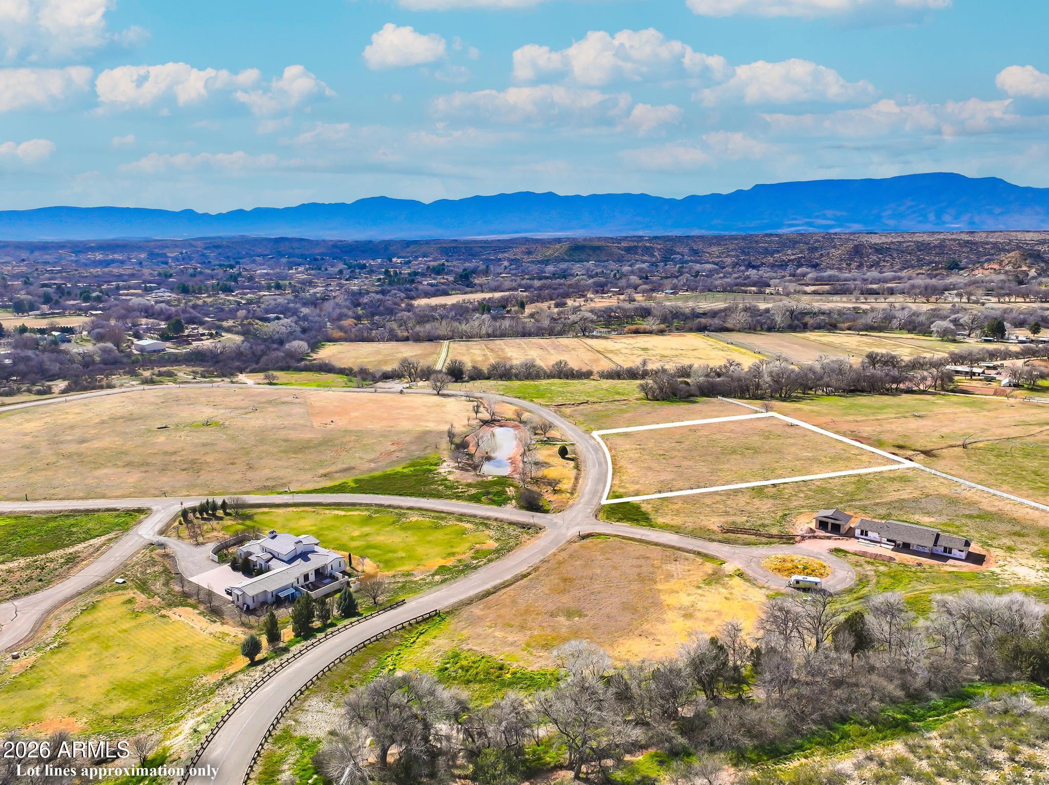 220 South Bonito Ranch Loop, Unit 9 Cornville, AZ 86325 - Photo 18 of 18 a view of a swimming pool with a table and chairs