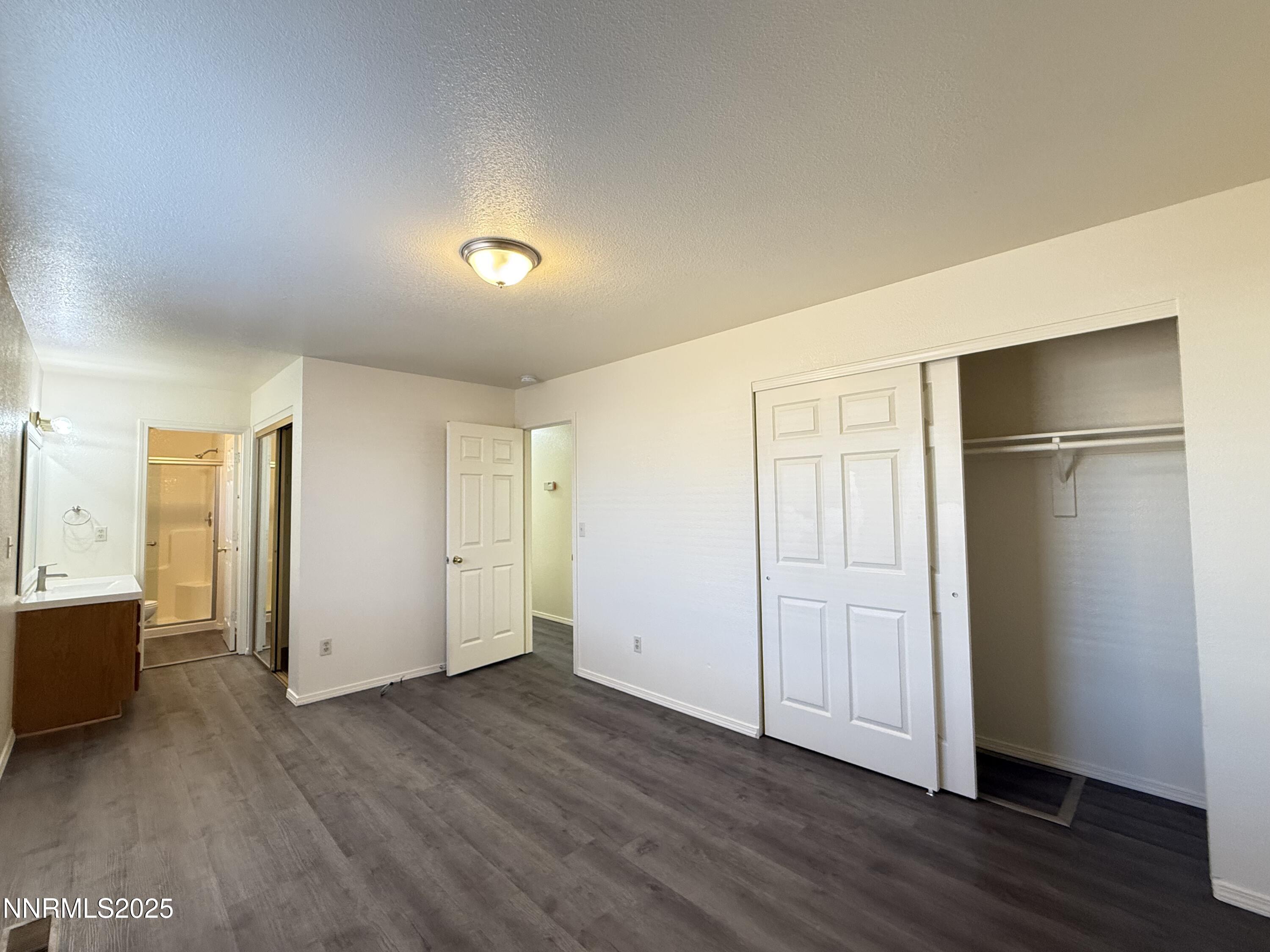 982 Ridgeview Drive Carson City, NV 89705 - Photo 11 of 16 an empty room with wooden floor & windows