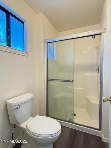 a white toilet sitting next to a bathroom sink