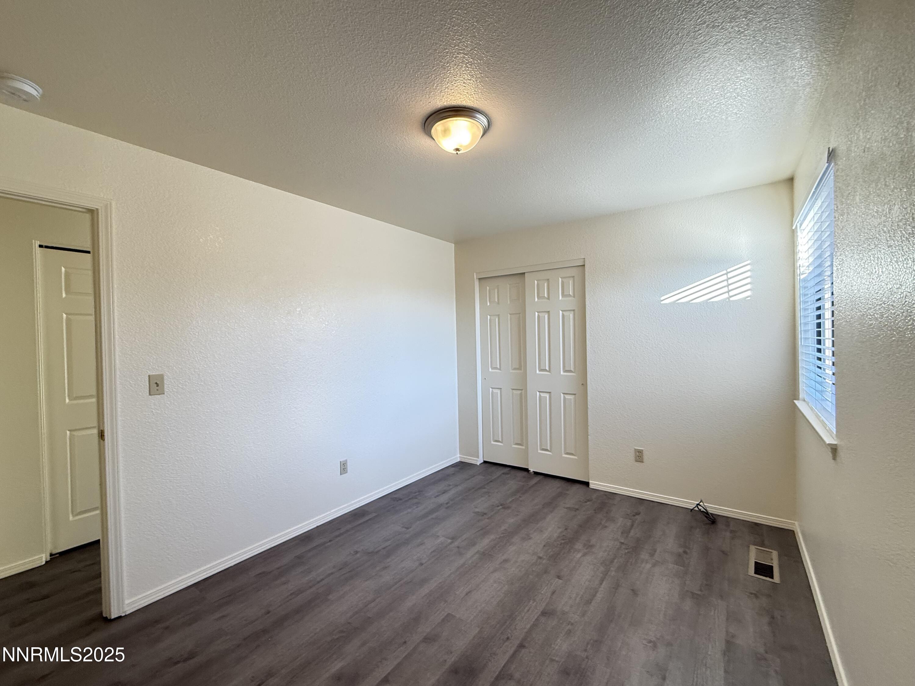 982 Ridgeview Drive Carson City, NV 89705 - Photo 9 of 16 wooden floor in an empty room