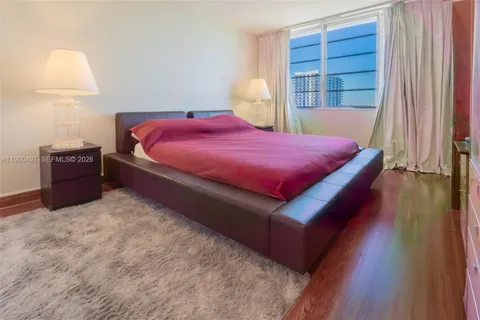 a bed room with a bed and a window