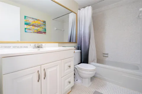 a bathroom with a sink a toilet and a bathtub