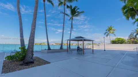 a view of a patio with a table and chairs