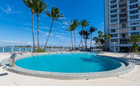 a view of a swimming pool with a lounge chairs