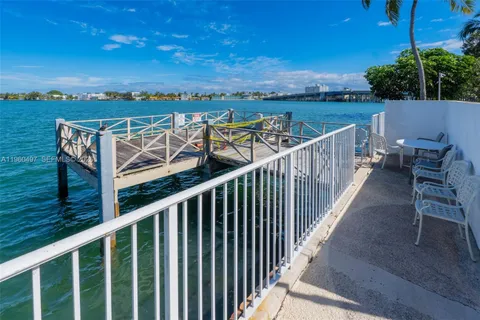 a view of a balcony with wooden floor and city view
