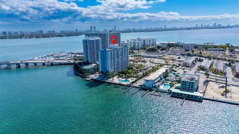 an aerial view of a house with a lake view