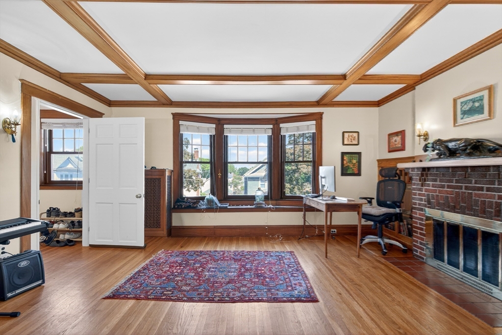 76-78 Lewis Road Belmont, MA 02478 - Photo 21 of 36 a living room with furniture and a fireplace