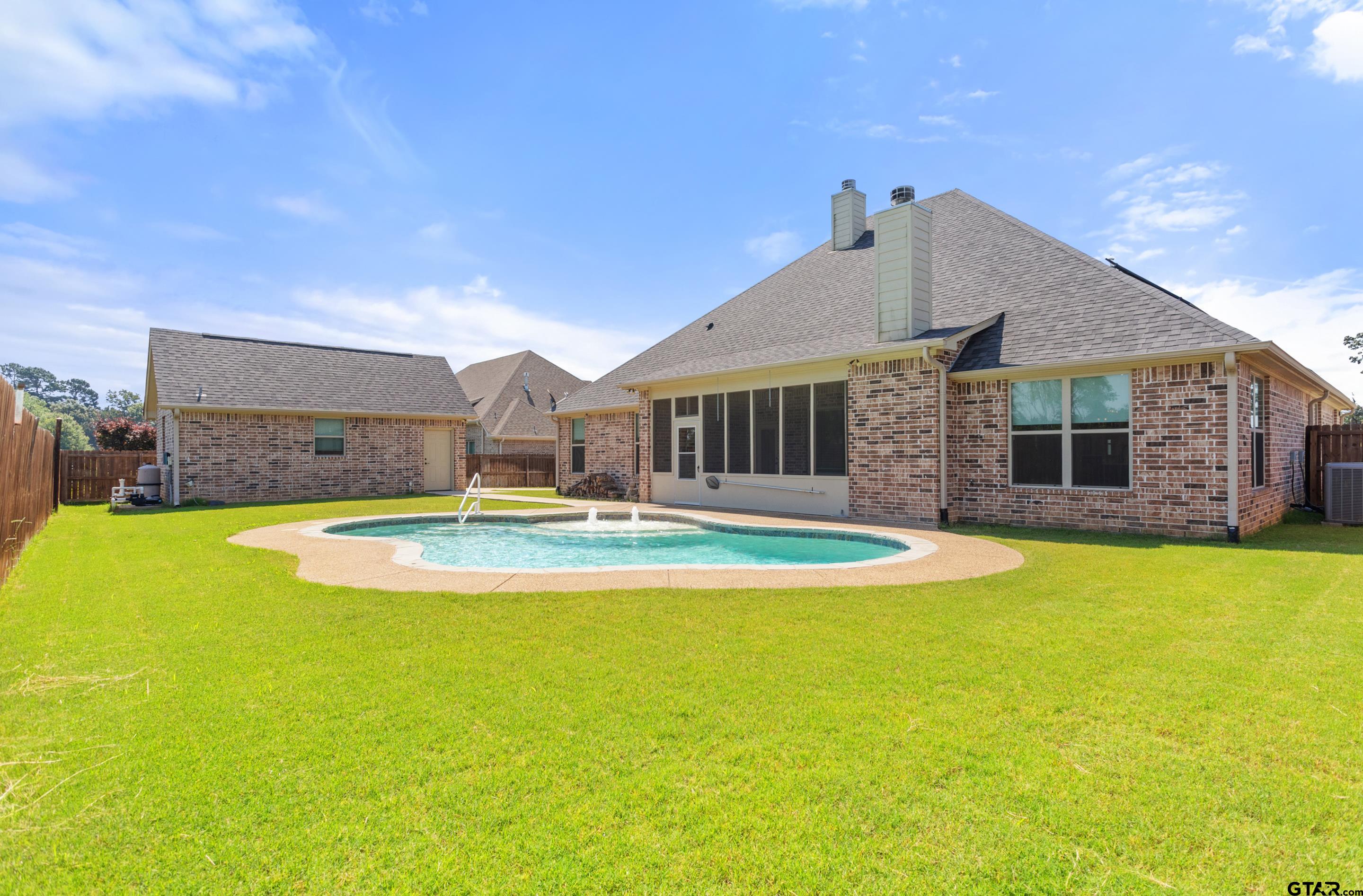 105 Nathan Road Chandler, TX 75758 - Photo 33 of 36 a view of a house with swimming pool and a yard