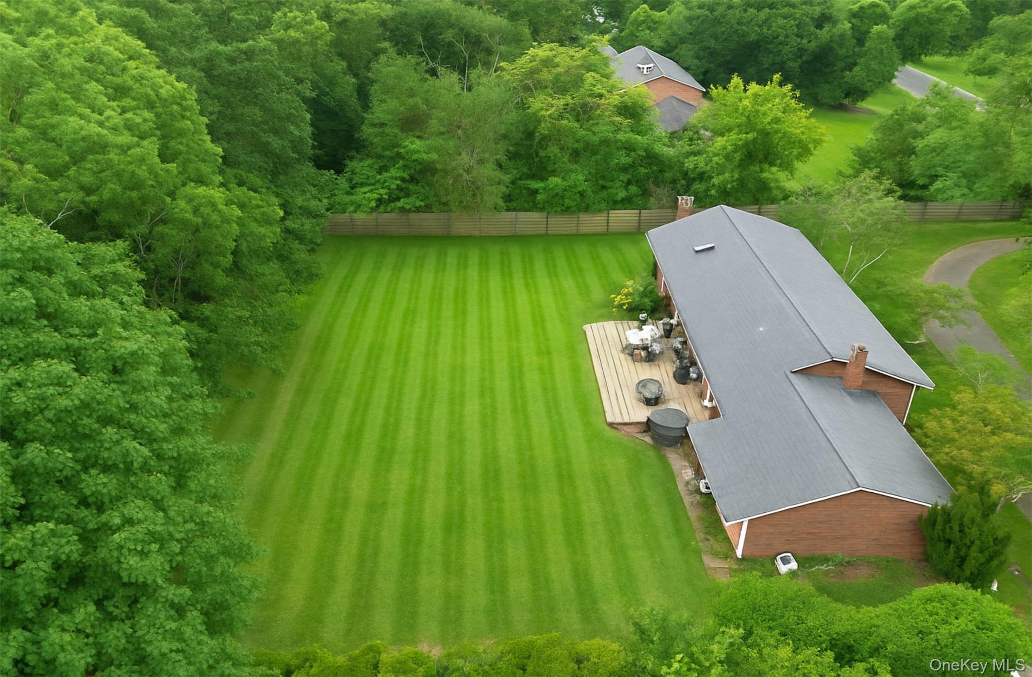 36 Nidzyn Avenue Remsenburg, NY 11960 - Photo 1 of 1 an aerial view of a house with a yard