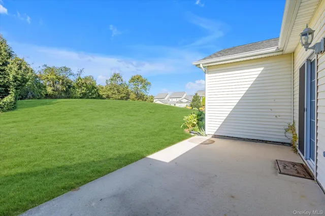 a view of a backyard with green space