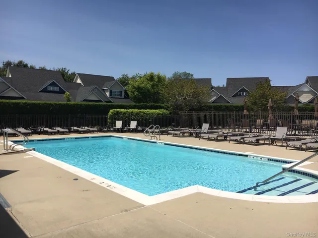 a view of a swimming pool and a yard