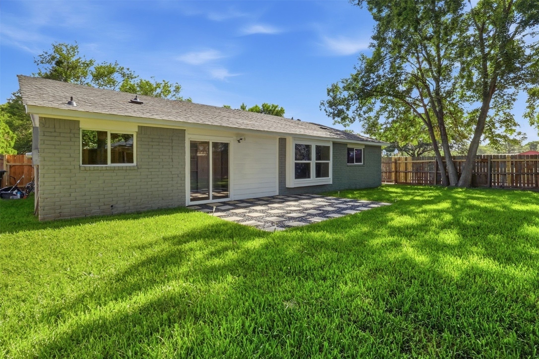4767 Beechaven Street Houston, TX 77053 - Photo 5 of 26 a view of a house with backyard and a tree