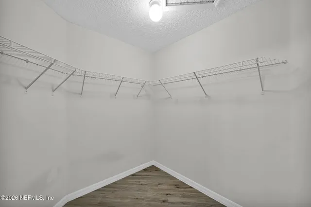 a view of a room with racks on the wall