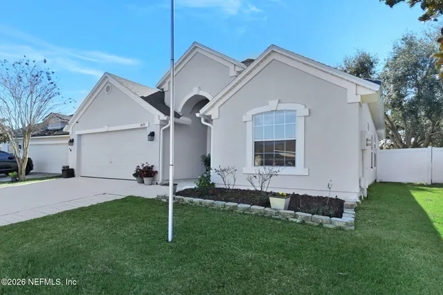a house that has a big yard in front of it