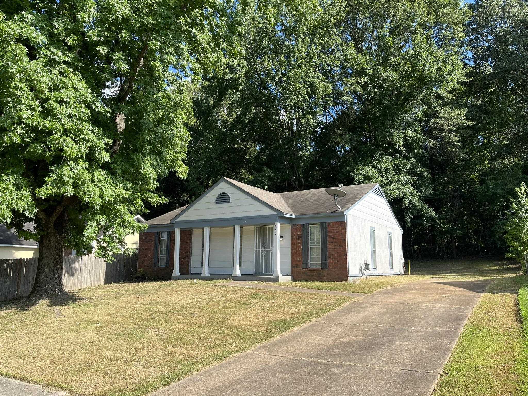 3273 Ridgemont Avenue Memphis, TN 38128 - Photo 1 of 16 a front view of a house with a garden