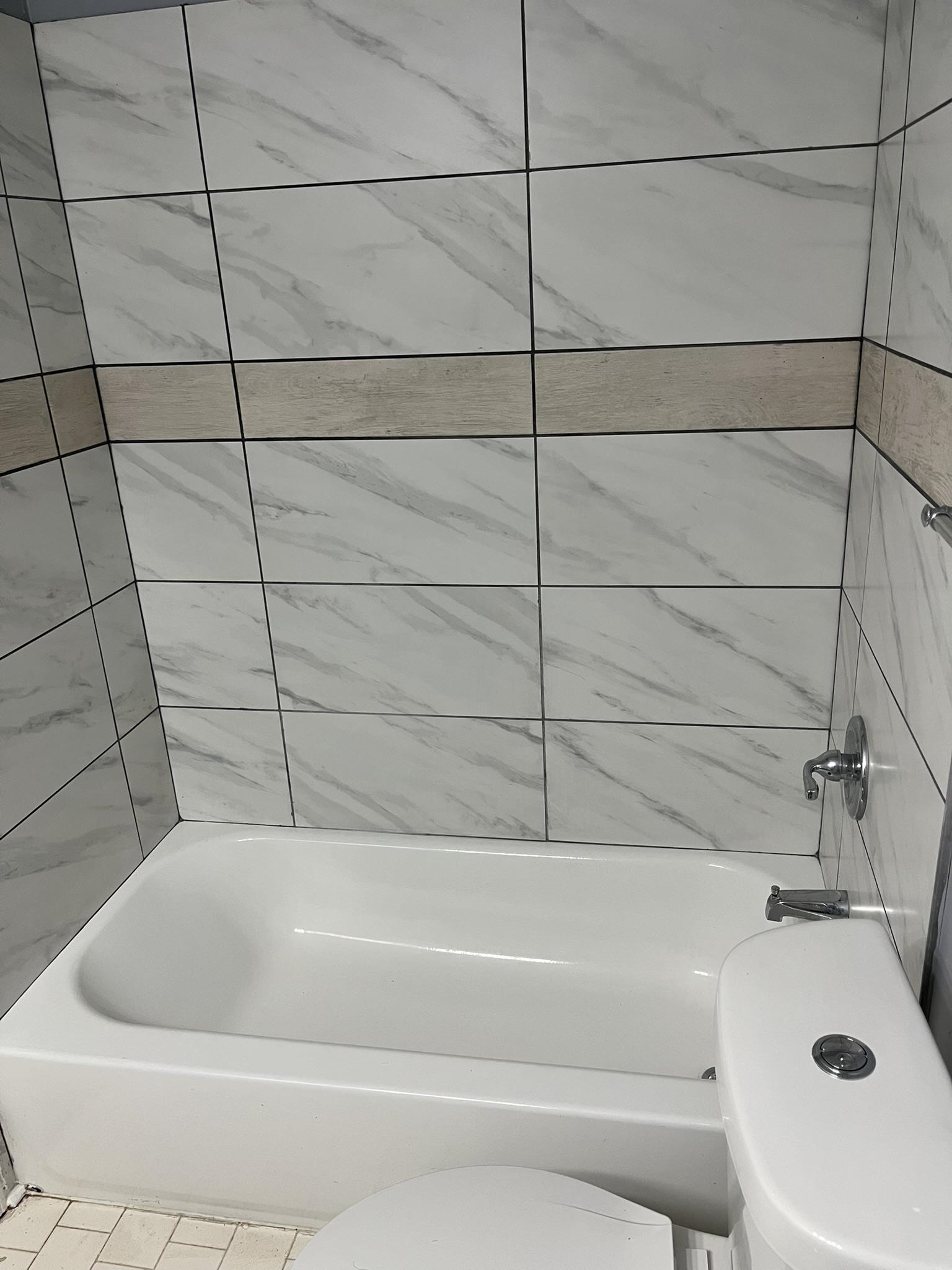 3273 Ridgemont Avenue Memphis, TN 38128 - Photo 11 of 16 a bathroom with a bathtub