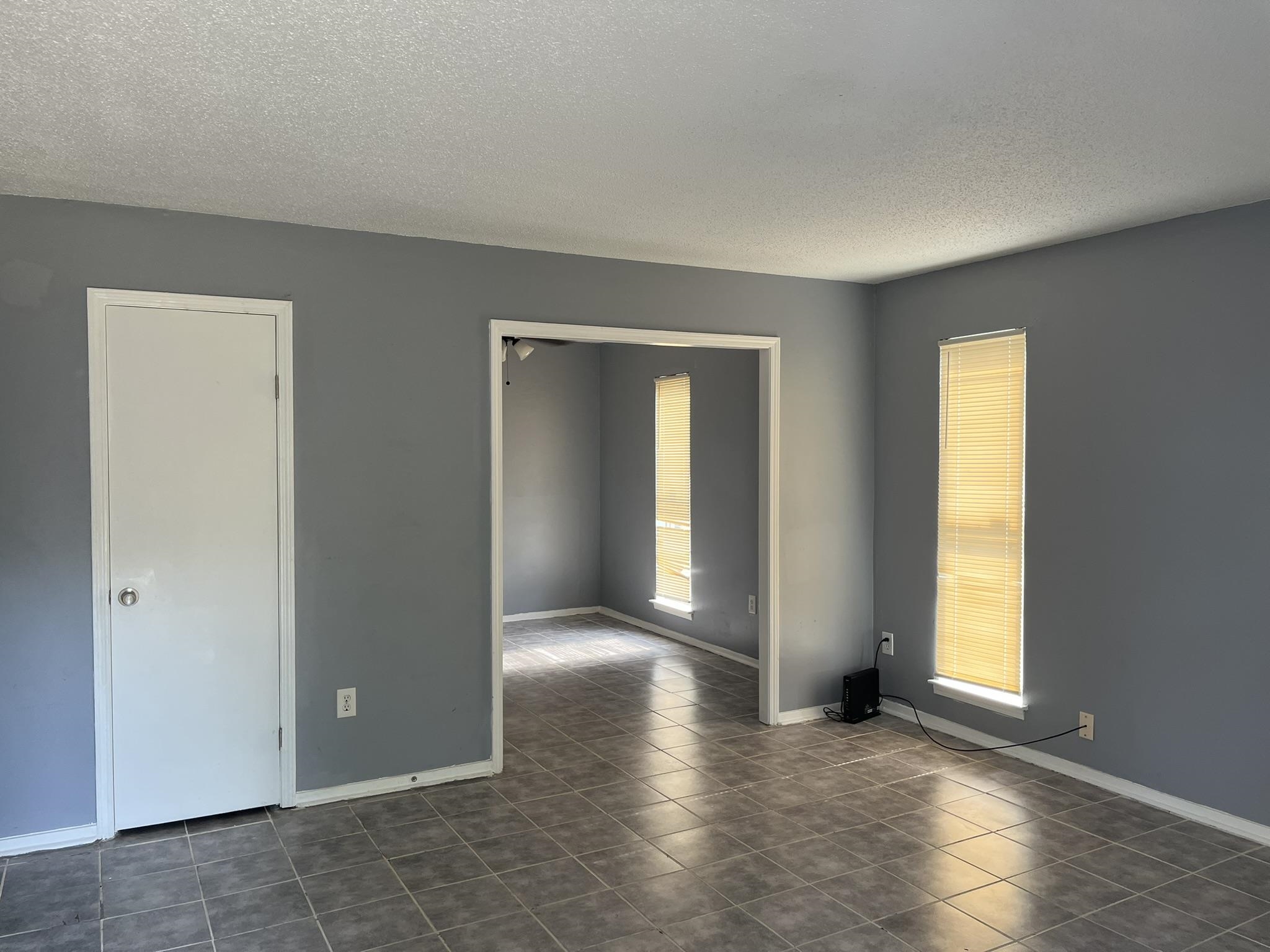 3273 Ridgemont Avenue Memphis, TN 38128 - Photo 3 of 16 an empty room with windows and closet