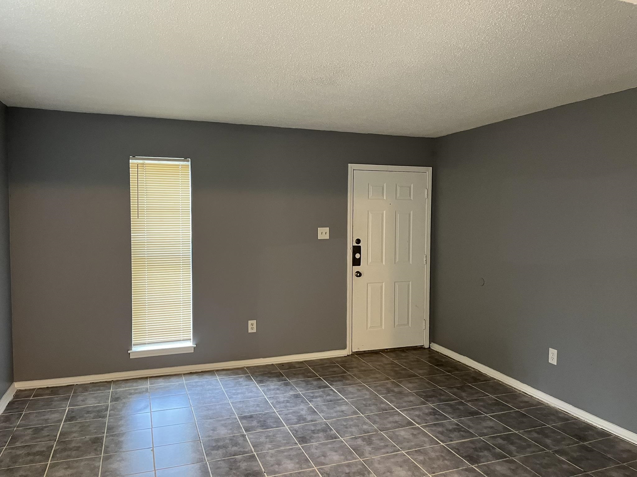 3273 Ridgemont Avenue Memphis, TN 38128 - Photo 5 of 16 a view of an empty room with a window