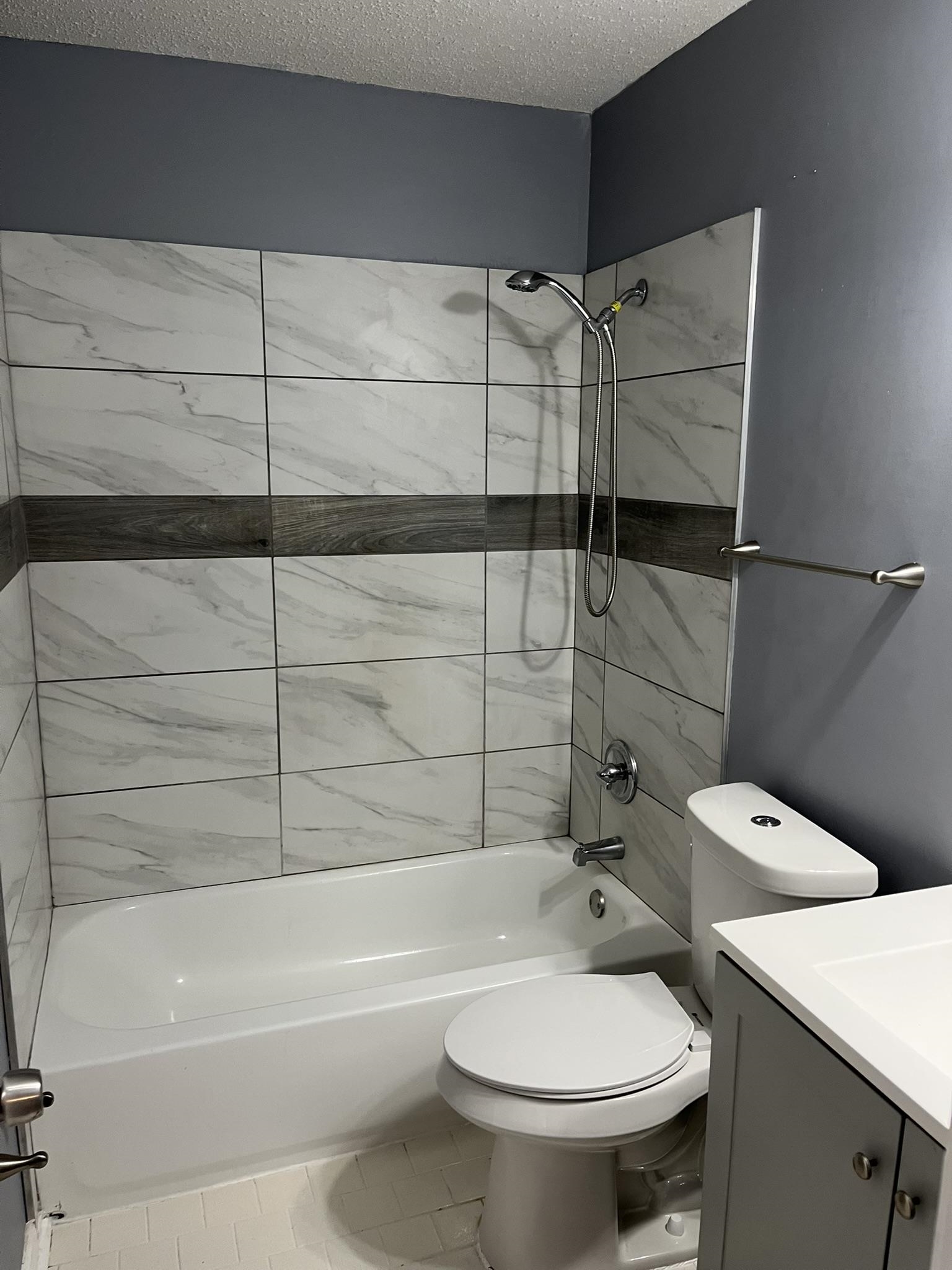 3273 Ridgemont Avenue Memphis, TN 38128 - Photo 10 of 16 a bathroom with a toilet and a shower