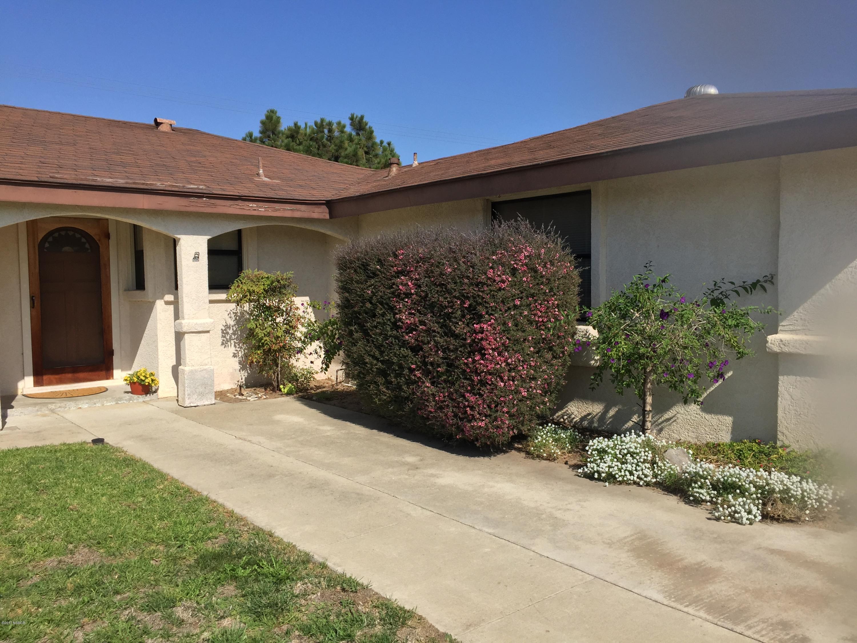 4035 Rigel Avenue Lompoc, CA 93436 - Photo 2 of 35 a front view of a house with garden