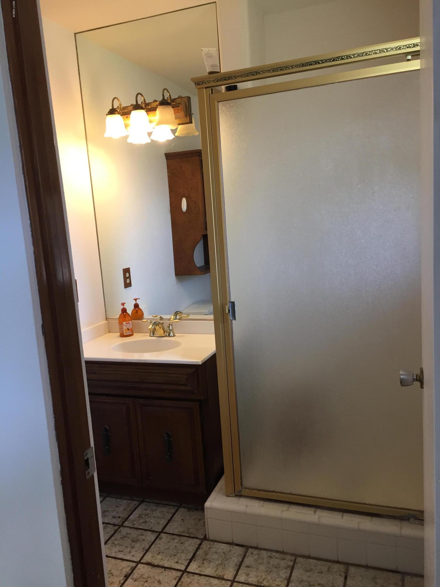 4035 Rigel Avenue Lompoc, CA 93436 - Photo 27 of 35 a bathroom with a sink and mirror
