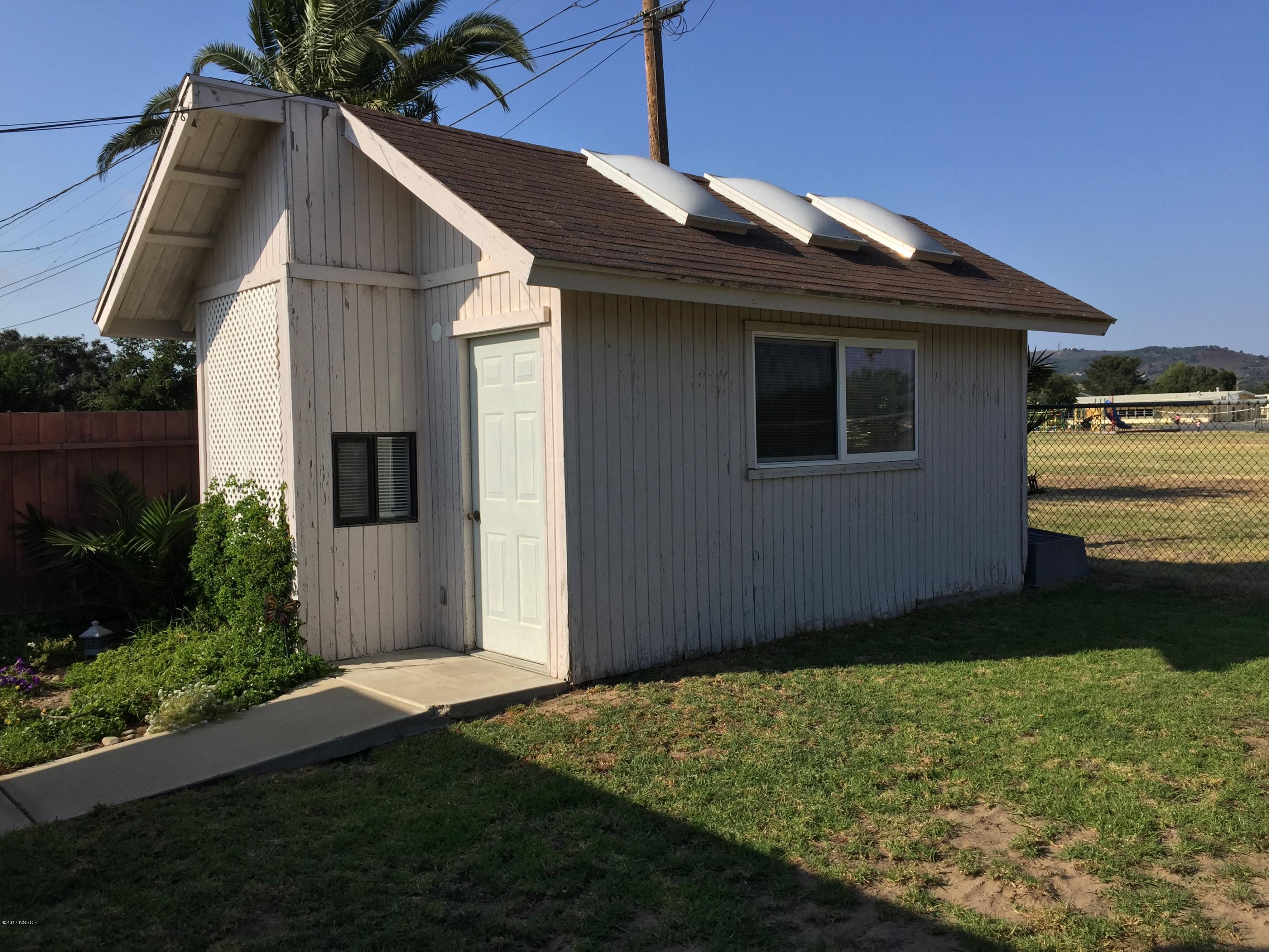 4035 Rigel Avenue Lompoc, CA 93436 - Photo 29 of 35 a backyard of a house with lots of green space