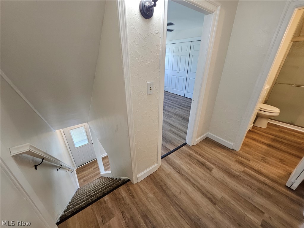 753 West River Road North Elyria, OH 44035 - Photo 11 of 28 Wood-finish flooring throughout the hallway and room beyond