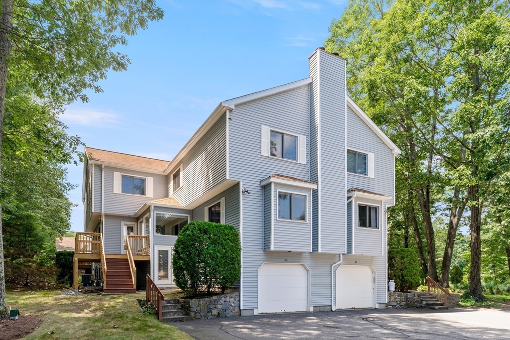 22 Arrowhead Circle, Unit 22 Ashland, MA 01721 - Photo 1 of 35 a front view of a house with garden