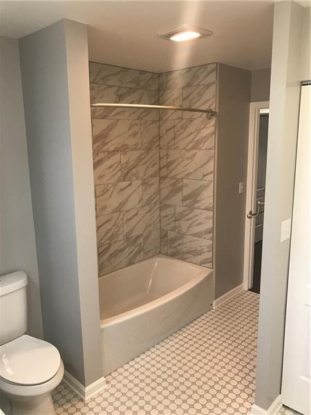 118 Sunflower Road Butler, PA 16001 - Photo 21 of 25 HUGE full bathroom with laundry. Gorgeous tile flooring and shower tile.