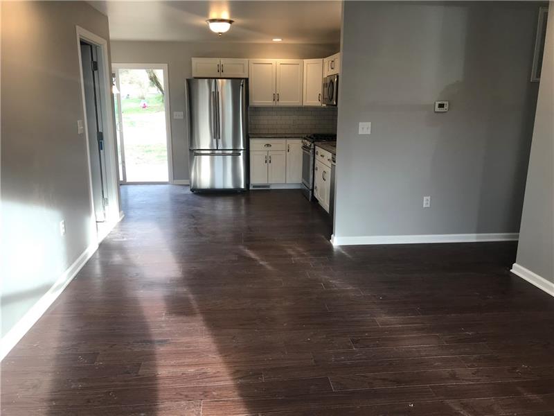 118 Sunflower Road Butler, PA 16001 - Photo 4 of 25 Beautiful and stunning view from the moment you walk in. High end laminate wood flooring flows throughout the entire home. Clear sight lines from front door to the back yard. So much natural light.