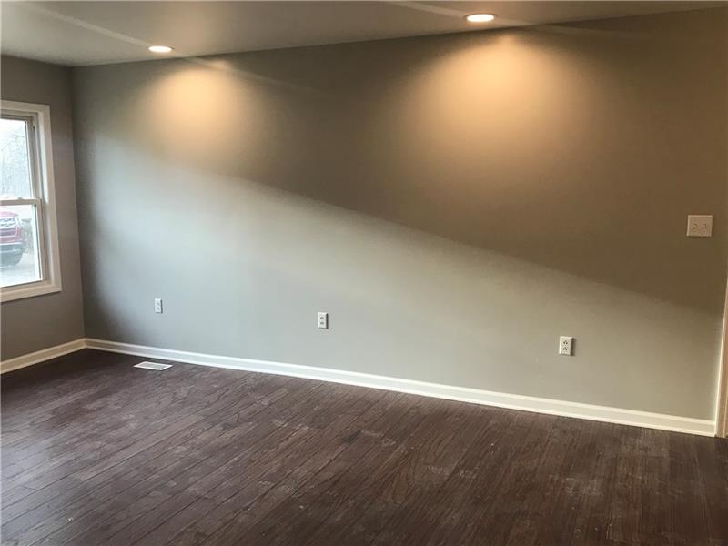 118 Sunflower Road Butler, PA 16001 - Photo 5 of 25 Huge wall for a couch with can lights in ceiling and views of the front yard and back yard. Open to the kitchen area allows for easy flow and conversation.