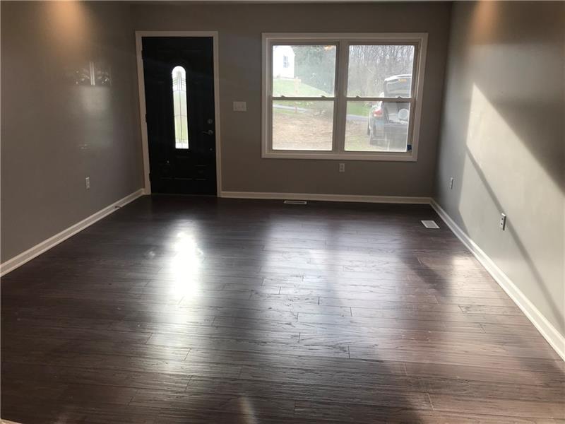 118 Sunflower Road Butler, PA 16001 - Photo 6 of 25 In all moments of the day this home has tons of natural light. Beautiful large living room will have you wanting to entertain this summer!