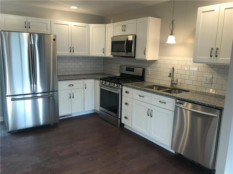 118 Sunflower Road Butler, PA 16001 - Photo 9 of 25 Brand new kitchen with stainless appliances (included), granite counter tops, deep sink and beautiful white subway tile back splash.