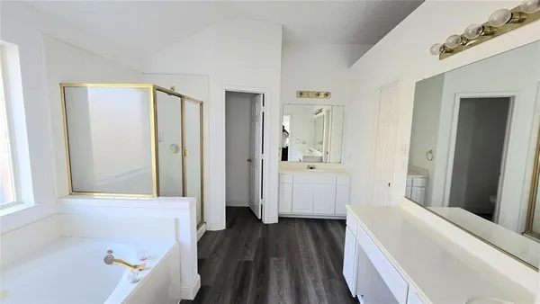 a bathroom with a bathtub and a sink