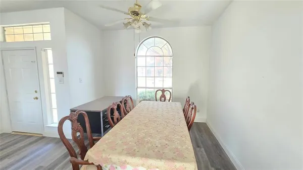 a view of a livingroom with furniture window and wooden floor