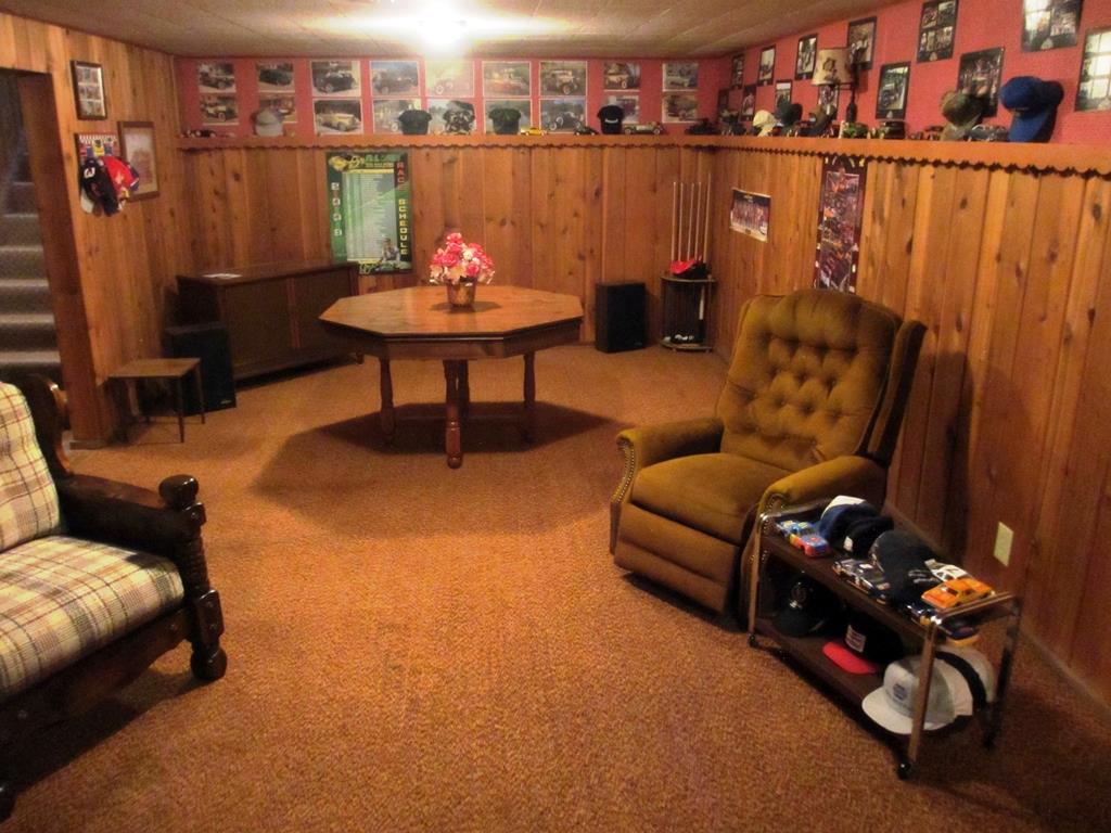 3729 Pinecrest Road Rockford, IL 61107 - Photo 20 of 22 a living room with furniture a rug and a chandelier