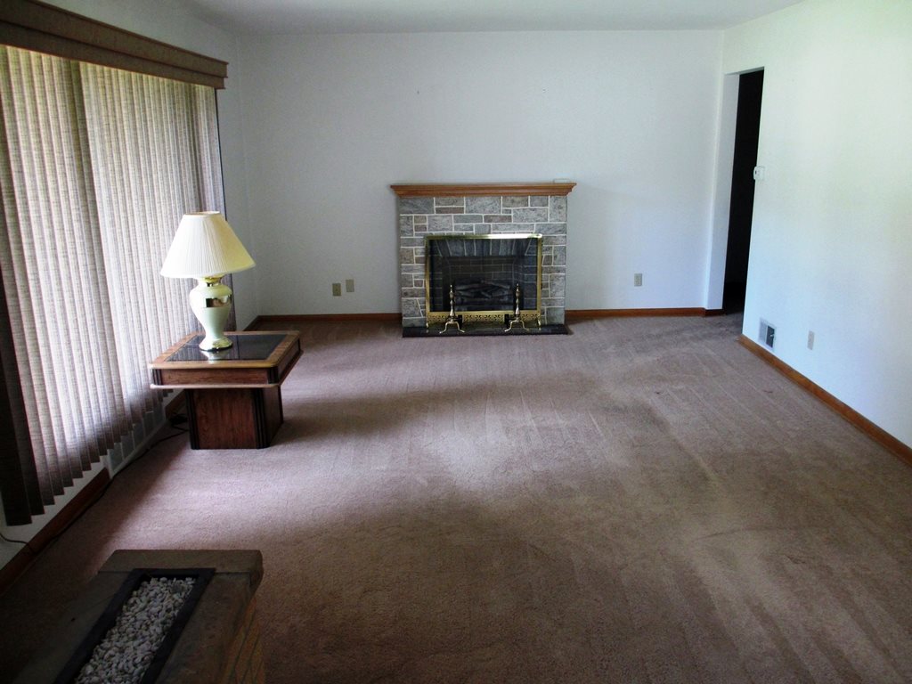 3729 Pinecrest Road Rockford, IL 61107 - Photo 5 of 22 a living room with furniture and a fireplace