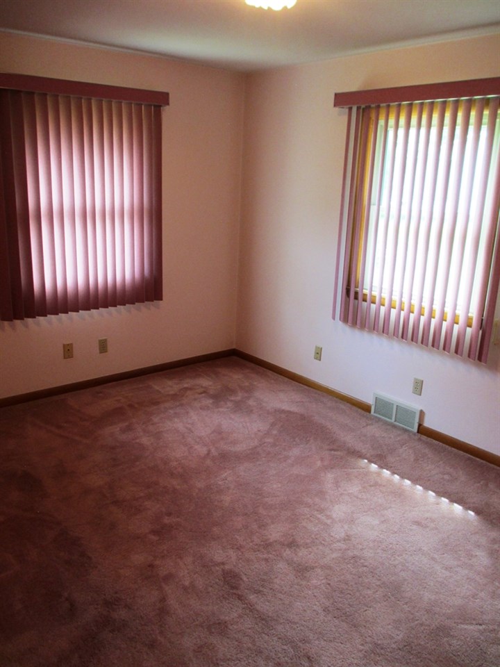 3729 Pinecrest Road Rockford, IL 61107 - Photo 9 of 22 an empty room with windows