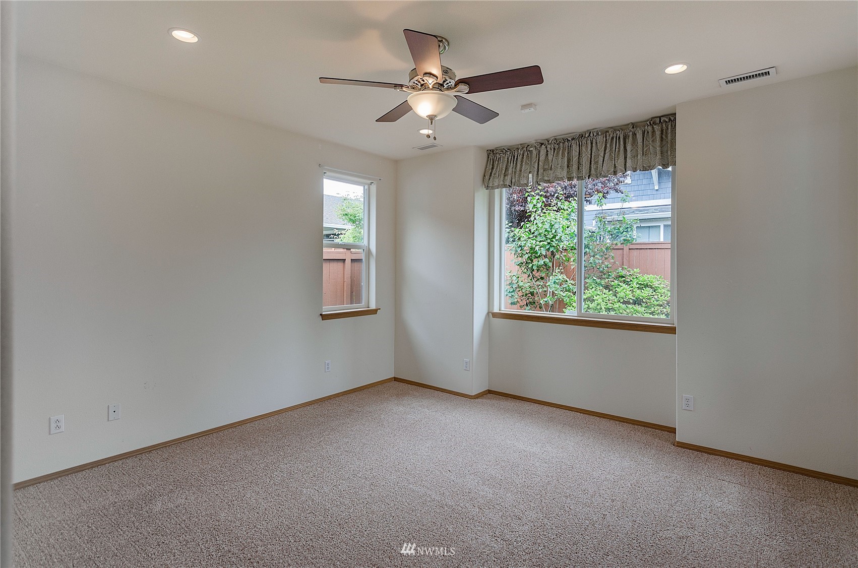 8228 Bainbridge Loop Northeast Lacey, WA 98516 - Photo 14 of 32 a view of an empty room with a window