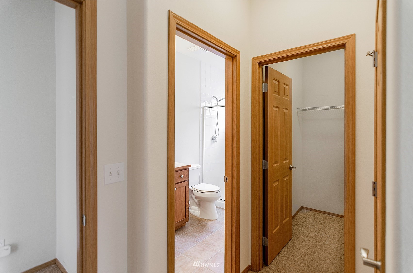 8228 Bainbridge Loop Northeast Lacey, WA 98516 - Photo 16 of 32 a view of bathroom with a shower and a toilet