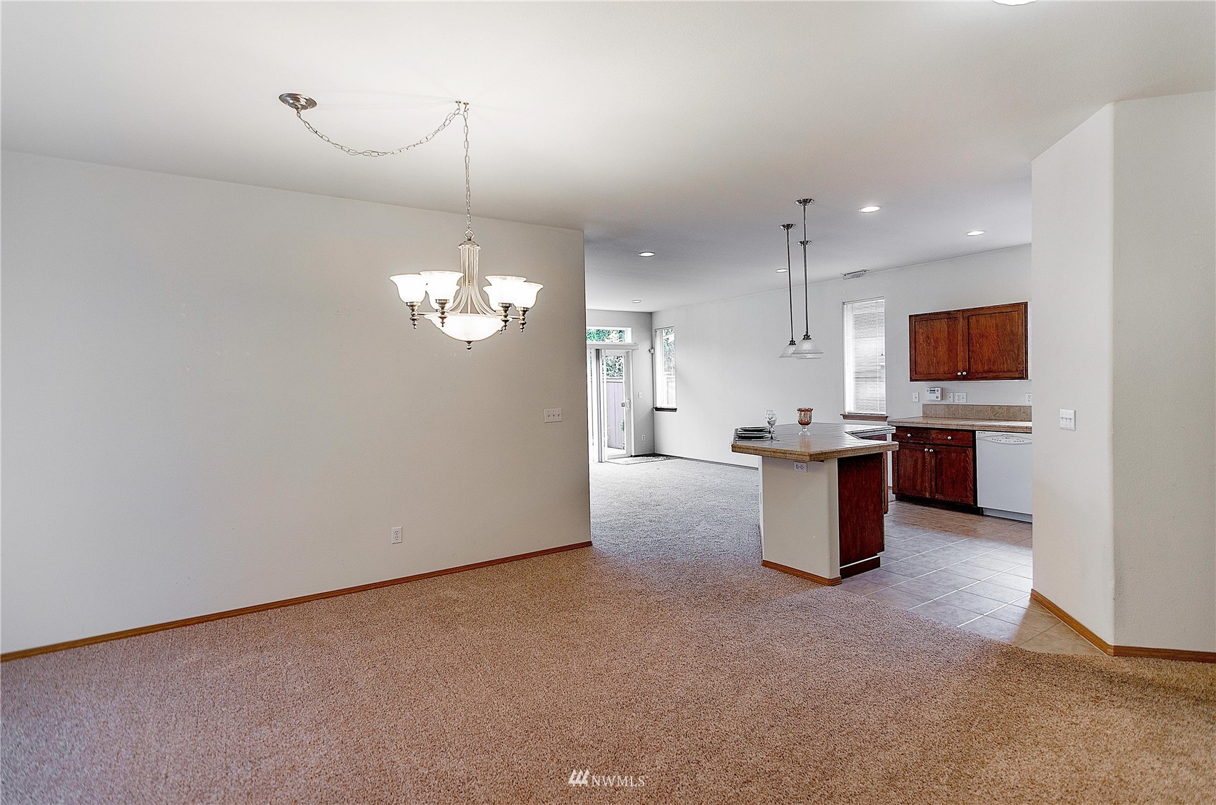 8228 Bainbridge Loop Northeast Lacey, WA 98516 - Photo 2 of 32 a view of a kitchen with stove top oven and cabinets