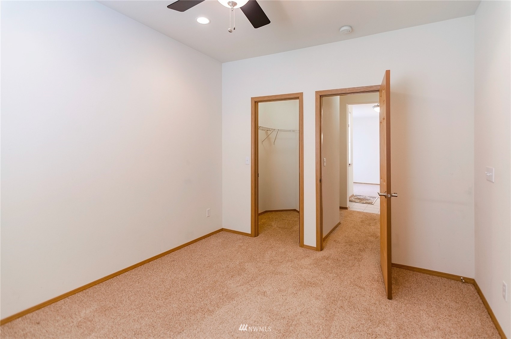 8228 Bainbridge Loop Northeast Lacey, WA 98516 - Photo 21 of 32 an empty room with ceiling fan