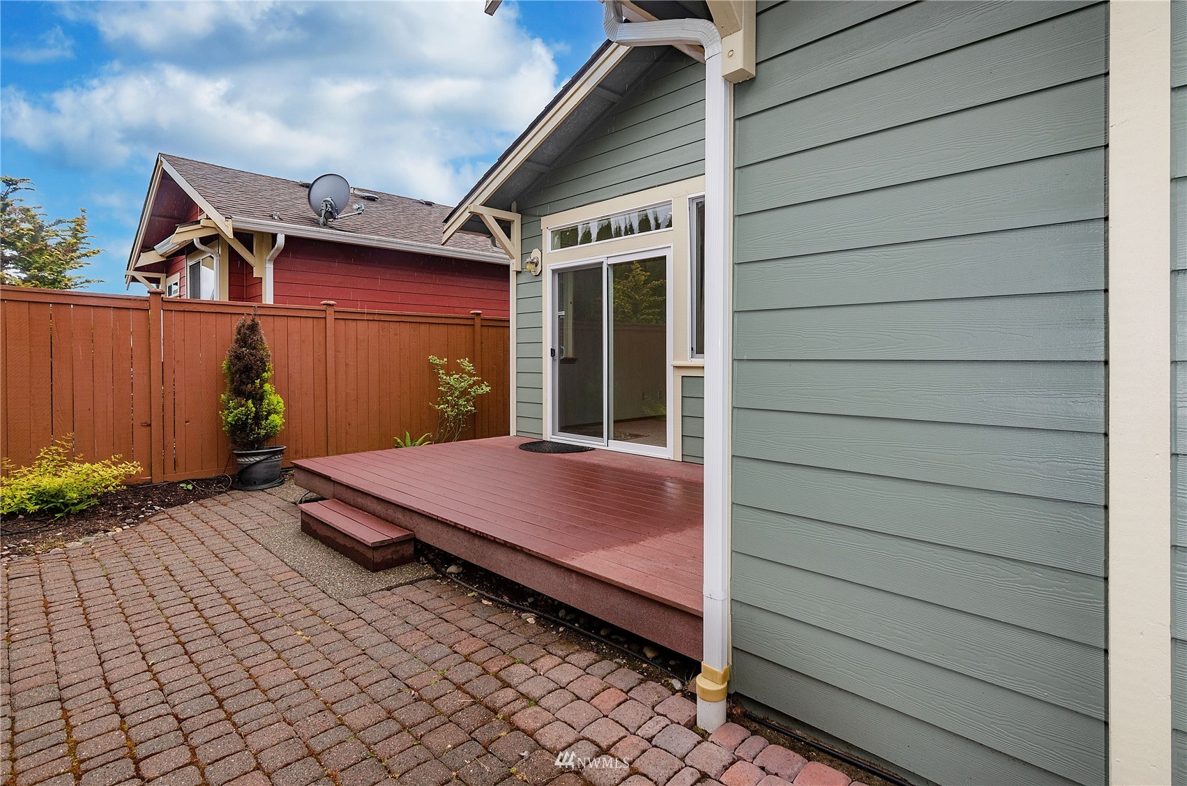 8228 Bainbridge Loop Northeast Lacey, WA 98516 - Photo 24 of 32 a patio with table and chairs