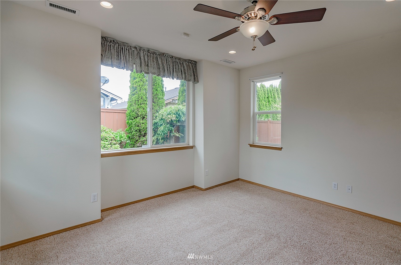 8228 Bainbridge Loop Northeast Lacey, WA 98516 - Photo 8 of 32 a view of an empty room with a window